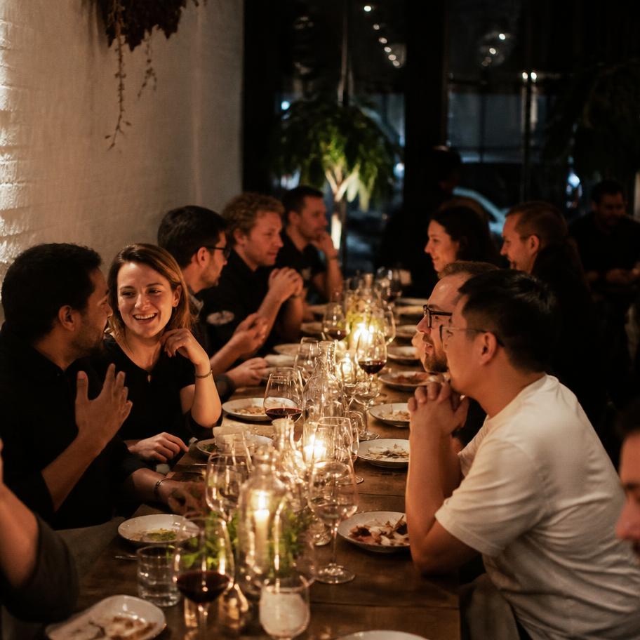 Guests around a table at an Introd founder dinner